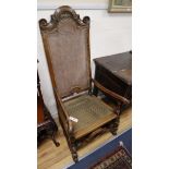 A 17th century and later Flemish walnut and beech caned highback chair
