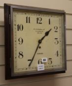 A W.C. Mann wall clock, dial 32cm square