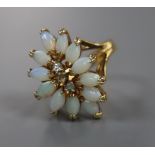 An 18k yellow metal, white opal and white sapphire? set dress ring, size L, gross 3.9 grams.