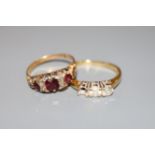 An early 20th century yellow metal, ruby? and diamond chip set ring and a modern 18ct gold and two(