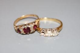An early 20th century yellow metal, ruby? and diamond chip set ring and a modern 18ct gold and two(