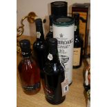 Eight bottles of late bottled vintage port and single malt whisky, comprising Delaforce 1977,