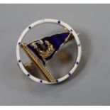 A 1950's 9ct gold and enamel set openwork circular pennant brooch, retailed by Benzies in Cowes,