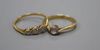 An 18ct and plat, solitaire diamond ring, size M/N, gross 2.5 grams and a yellow metal and three