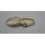 An 18ct and plat, solitaire diamond ring, size M/N, gross 2.5 grams and a yellow metal and three