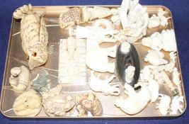 A group of assorted pre WWII ivory carving, mostly animals, together with several resin