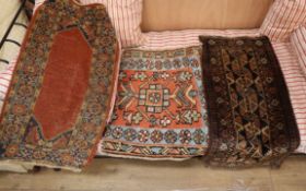 A Turkish red ground mat and two others, largest 64 x 53cm