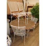 A circular metal garden table and four chairs, Diam.116cm, H.73cm Condition report: The table top