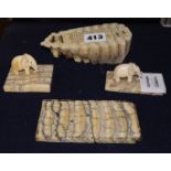 Two ivory elephant figures with elephant tooth stands and two elephant tooth specimens, early 20th