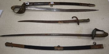 Two officer's swords and a bayonet