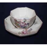 A Chelsea red anchor period octagonal tea bowl and saucer, c.1756, painted with floral sprays and