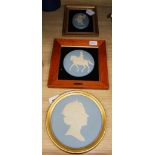 Three Wedgwood blue and white Jasperware framed plaques, comprising a circular portrait