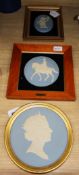 Three Wedgwood blue and white Jasperware framed plaques, comprising a circular portrait