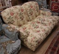 A Howard style upholstered two seater settee, W.150cm., D.110cm, H.80cm