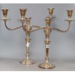 A pair of silver plated three light two branch candelabra, height 44cm