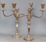 A pair of silver plated three light two branch candelabra, height 44cm