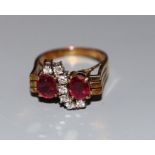 A 585 yellow metal ruby and diamond dress ring, size N, gross weight 5.4 grams.