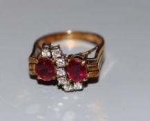 A 585 yellow metal ruby and diamond dress ring, size N, gross weight 5.4 grams.