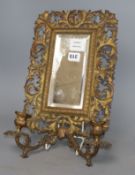 A Victorian gilt metal two sconce wall mirror, W.24cm, H.40cm.CONDITION: Two the left of the plate