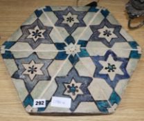 An Islamic hexagonal tile, 43cm sq.