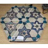 An Islamic hexagonal tile, 43cm sq.