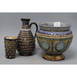 Three pieces of Doulton Lambeth ware, tallest 23.5cmCONDITION: Jug has a re-glued section near the