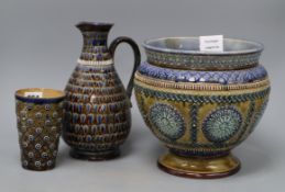 Three pieces of Doulton Lambeth ware, tallest 23.5cmCONDITION: Jug has a re-glued section near the