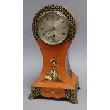 A Japanned balloon mantel timepiece, height 36cmCONDITION: The movement is loose in the case and