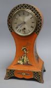 A Japanned balloon mantel timepiece, height 36cmCONDITION: The movement is loose in the case and