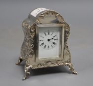 A late Victorian repousse silver mounted timepiece, by William Comyns, London, 1900, 9.5cm, with