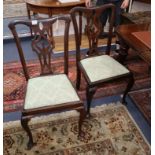 A set of four Chippendale style dining chairs