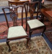 A set of four Chippendale style dining chairs