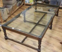 A rectangular glass top hardwood coffee table, W.190cm, D94cm, H.41cm