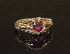 A late Victorian yellow metal and claw set solitaire garnet ring, size J, gross 4.2 grams.