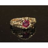 A late Victorian yellow metal and claw set solitaire garnet ring, size J, gross 4.2 grams.