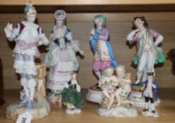 Two pairs of French porcelain figures and three other groups, tallest 33cmCONDITION: The larger