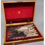 Twenty three Christofle silver plate handled knives, of various sizes