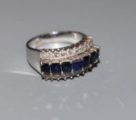 A modern 18k white metal and three row sapphire and diamond set dress ring, size O, gross weight 6.5