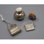 A miniature 925 purse. a silver pig pin cushion, marks rubbed, a 925 envelope stamp case and an