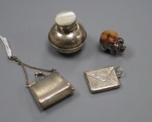 A miniature 925 purse. a silver pig pin cushion, marks rubbed, a 925 envelope stamp case and an