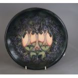 A Moorcroft 'Cluny' plate designed by Sally Tuffin, diameter 26cmCONDITION: Good condition