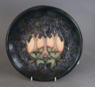 A Moorcroft 'Cluny' plate designed by Sally Tuffin, diameter 26cmCONDITION: Good condition