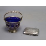 An Edwardian silver sugar basket, with blue glass liner(chip to rim) and an engraved silver