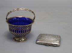 An Edwardian silver sugar basket, with blue glass liner(chip to rim) and an engraved silver