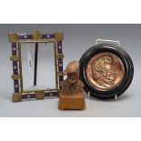 An champléve enamel brass photograph frame, a copper relief plaque signed Schubert and a bust of