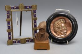 An champléve enamel brass photograph frame, a copper relief plaque signed Schubert and a bust of