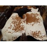 A pony skin rug and four goat skin mats, pony skin, 200 x 180cm