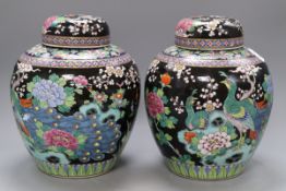 A pair of Japanese famille noire vases and covers, overall height 28cmCONDITION: One lid is badly