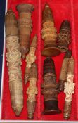 A group of 19th century Swiss treen cotton reel holders and needle cases, some of spire form,