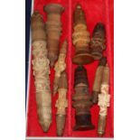 A group of 19th century Swiss treen cotton reel holders and needle cases, some of spire form,